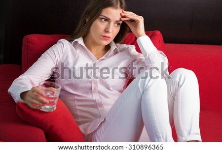 Young woman suffering from the sudden pain Royalty-Free Stock Photo #310896365