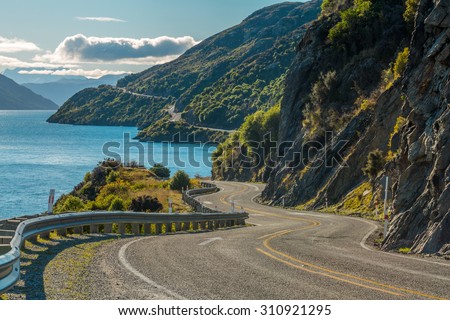Road along Lake Wakatipu, Queenstown, New Zealand Royalty-Free Stock Photo #310921295
