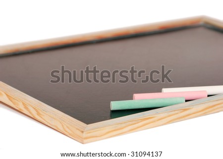 stick of colored chalk on a blackboard isolated on white background