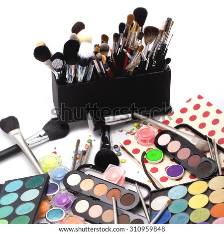 Set of many professional visagiste eyeshadow palette red orange green violet pink yellow purple black beige brown colors foundation powder and make-up brushes on white background, square picture