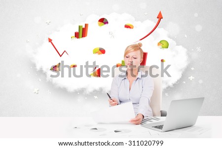 Beautiful young businesswoman with cloud in the background containing colorful graphs and diagrams
