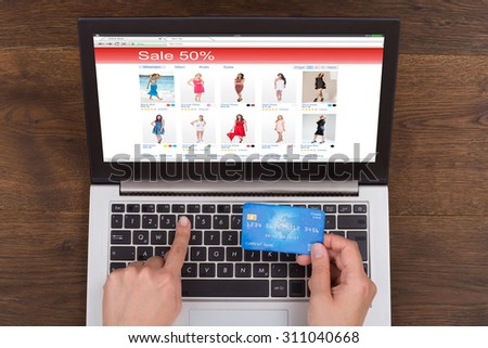 Person Hands Shopping Online With Credit Card And Laptop At Desk