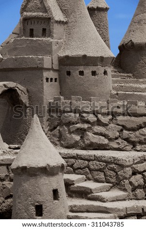 Sand Castle with blue background.
Copy space
