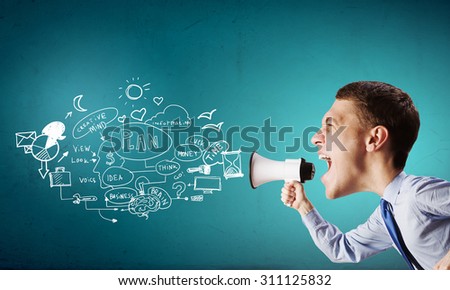 Funny young man with big head screaming emotionally in megaphone