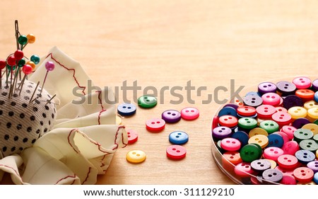 Sewing Colorful Plastic buttons