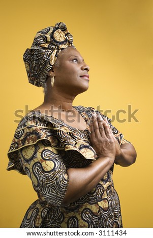 African American mature adult female dressed in African costume.