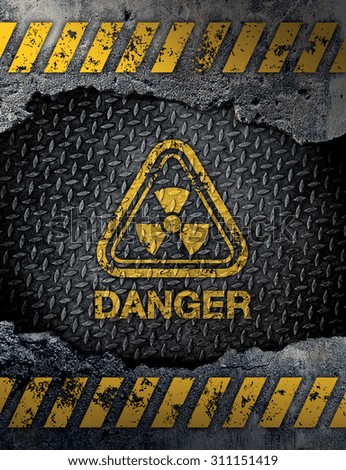 Danger sign on rusty metal background