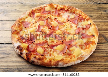 top view hawaiian  pizza  rustic table background