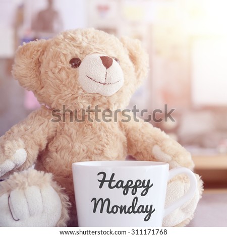 Teddy bear and coffee cup,focused on teddy bear face in Blurred background with vintage filter