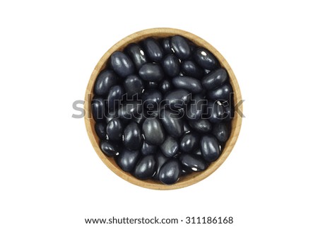 corn black beans in a wooden bowl on a white background