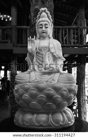 black and white buddha sculpture 
