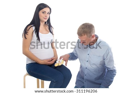 Photo of sitting pregnant woman and man on white background