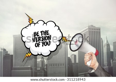 Be the version of you text on speech bubble and businessman hand holding megaphone on city background