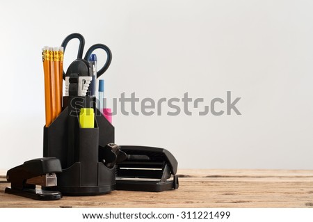 Stationery on wooden table on a gray background, closeup. Copy space. Free space for text Royalty-Free Stock Photo #311221499