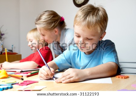 Drawing lesson in an elementary school Royalty-Free Stock Photo #31122193