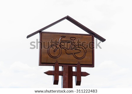 Wooden bicycle road sign
