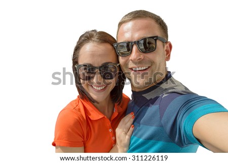 Couple taking selfie photo, isolated studio shot