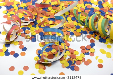 A colorful picture of a close-up of confetti and ribbons