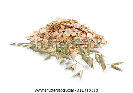 Oat flakes with herb. Isolated on white background. Royalty-Free Stock Photo #311318318