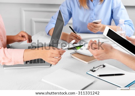 Work process of business meeting with electronic devices in office