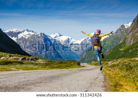 young hipster female traveler enjoy the travel. Adventure is coming... Royalty-Free Stock Photo #311342426