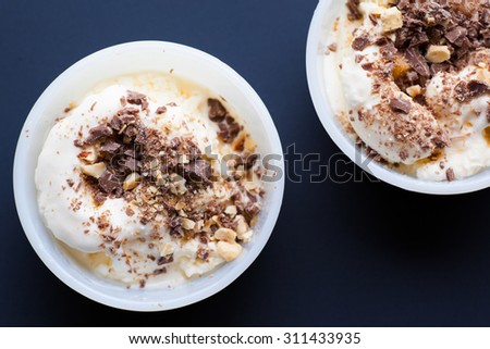 Two vanilla ice-cream with chocolate. Selective focuse