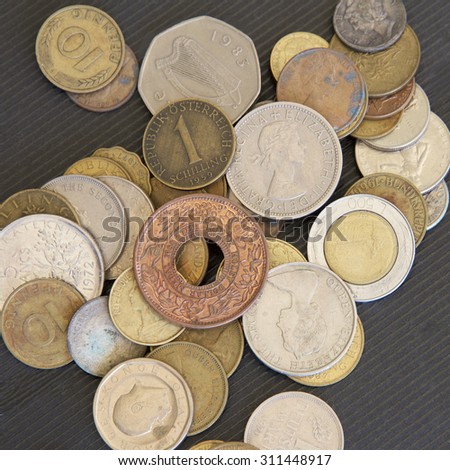 A number of dirty old coins from various countries.