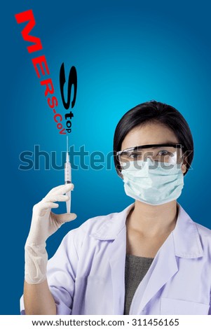 Doctor holding medical injection syringe and hanging stethoscope with text of "Stop MERS-CoV". Concept for MERS Disease Promotion ,Prevention or Care.