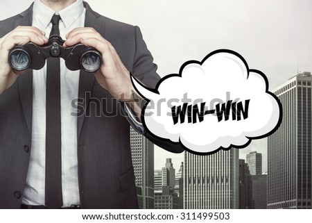 Win win text on speech bubble with businessman holding binoculars on city background