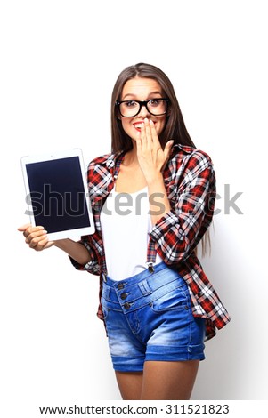 Young woman showing tablet isolated on white background