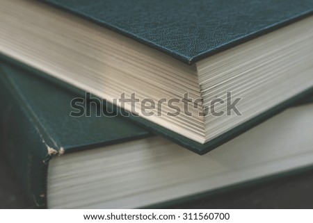 old books close up with green leather cover