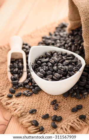 Vigna mungo or black beans with wooden spoon