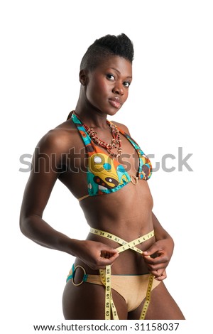 Slim african american girl in bikini with tape measure around her waist