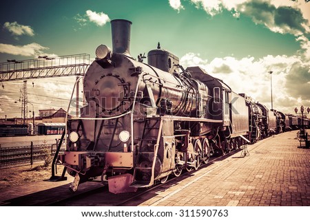 Old steam locomotive, vintage train. Royalty-Free Stock Photo #311590763