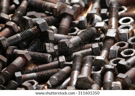 Old rusty bolts with spare part.