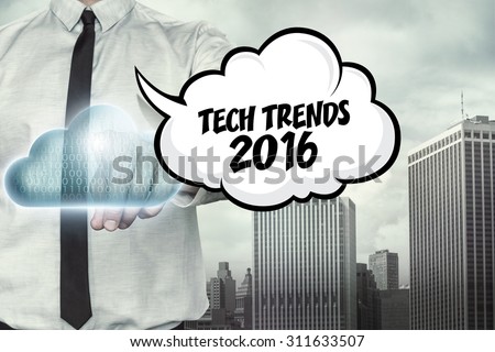 Tech trends 2016 text on cloud computing theme with businessman on cityscape background