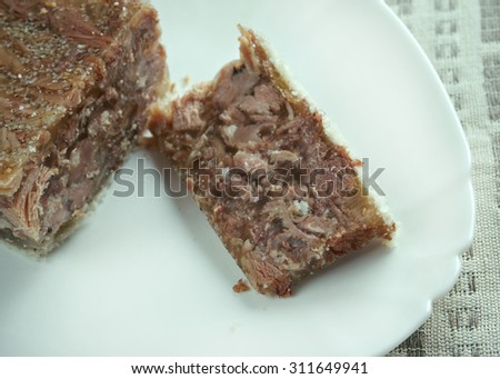 Jellied veal - cold cut dish made from veal, sometimes pork, stock, onion and spices such as allspice.traditional dish for Christmas in Sweden