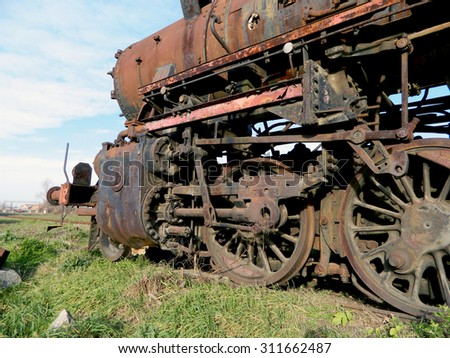 Large, old steam locomotive, which for years waiting for repair and Museum.                               