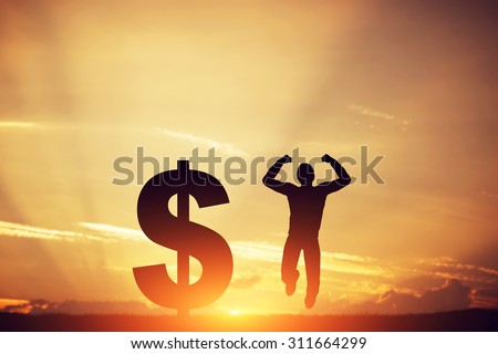 Happy man jumping for joy next to dollar symbol. Winner of lottery, financial business success concept Royalty-Free Stock Photo #311664299