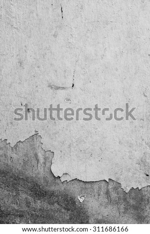 Texture background of the old wall, black and white. The peeling paint.
