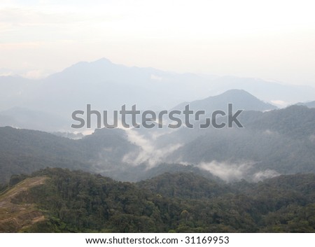 A shot taken from the mountain. Showing cloudscape and mountains.