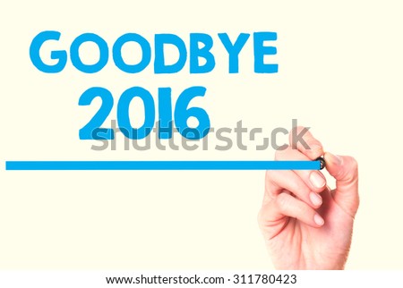 Female hand writting goodbye 2016  with marker