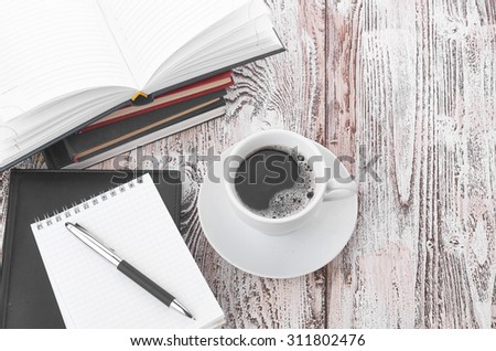 Cup of coffee on a wooden table