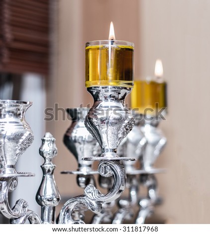 silver Menorah Hanukkah With olive oil