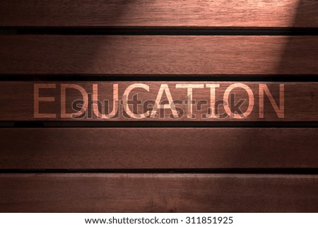 education text on wooden