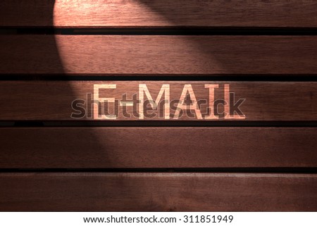 e mail text on wooden