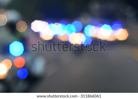 Defocused bokeh lights with emergency police, ambulance and firefighters lights in blur background.