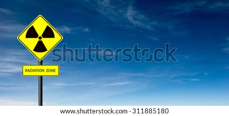 nuclear radiation warning symbol with blue sky