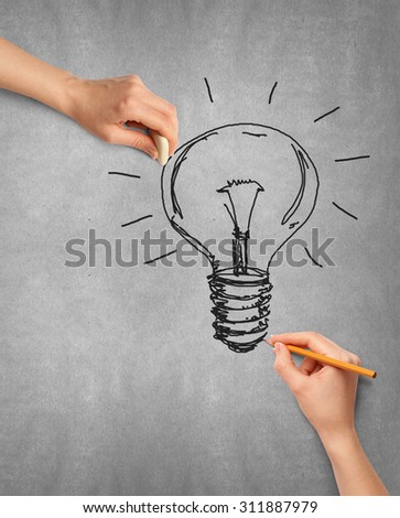 Idea background with lamp, sketch and human hand with pencil