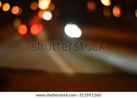 Blur image of Putrajaya Highway at night with bokeh.
